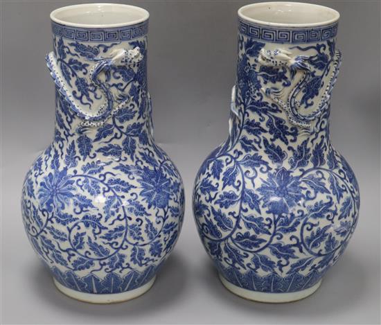 A pair of large 19th century Chinese blue and white vases height 35cm - one a.f.